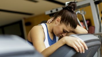 Pretty young woman training at the gym