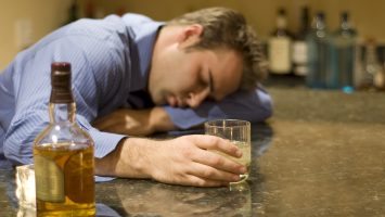 young man passed out from drinking alcohol